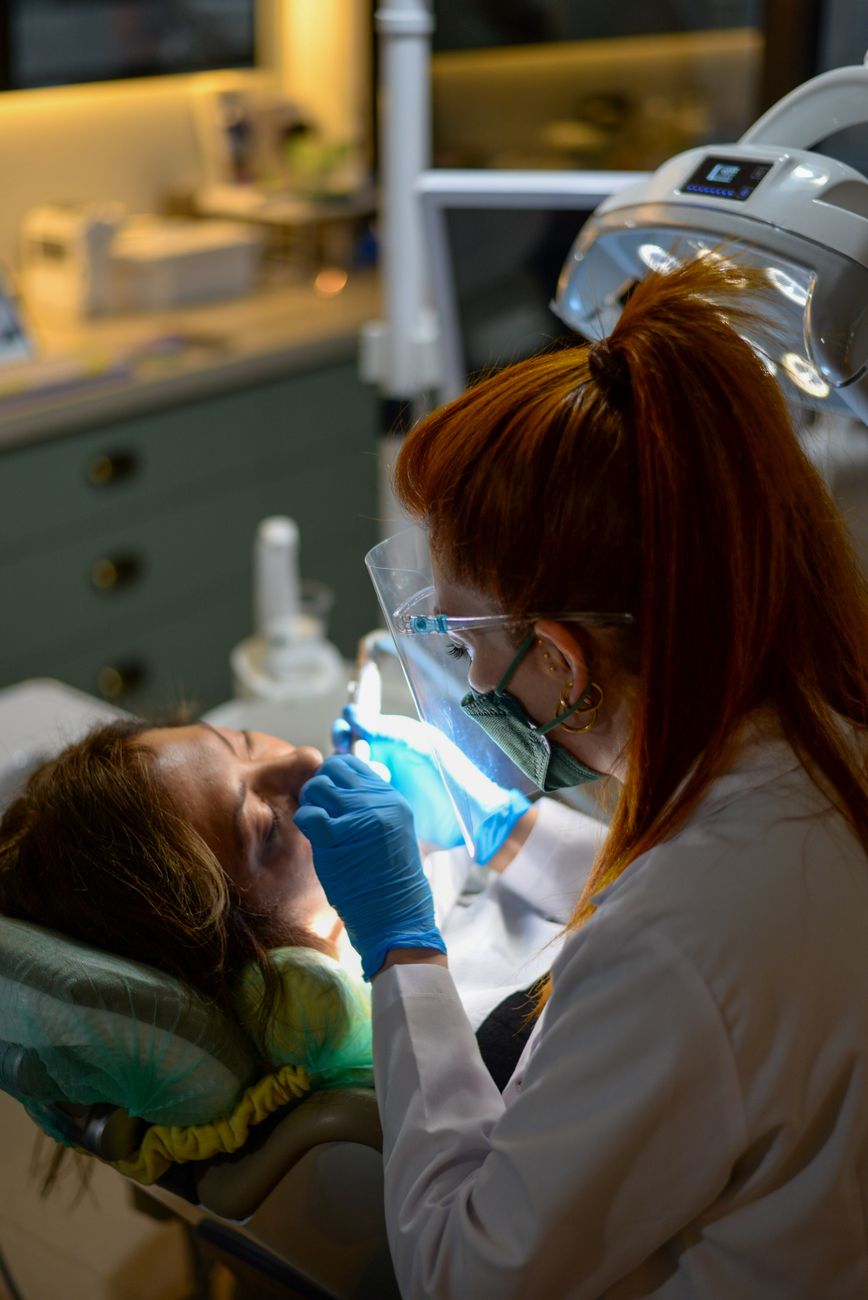 back view of working dentist